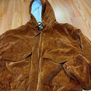 Brown corduroy jacket with white sherpa lining.